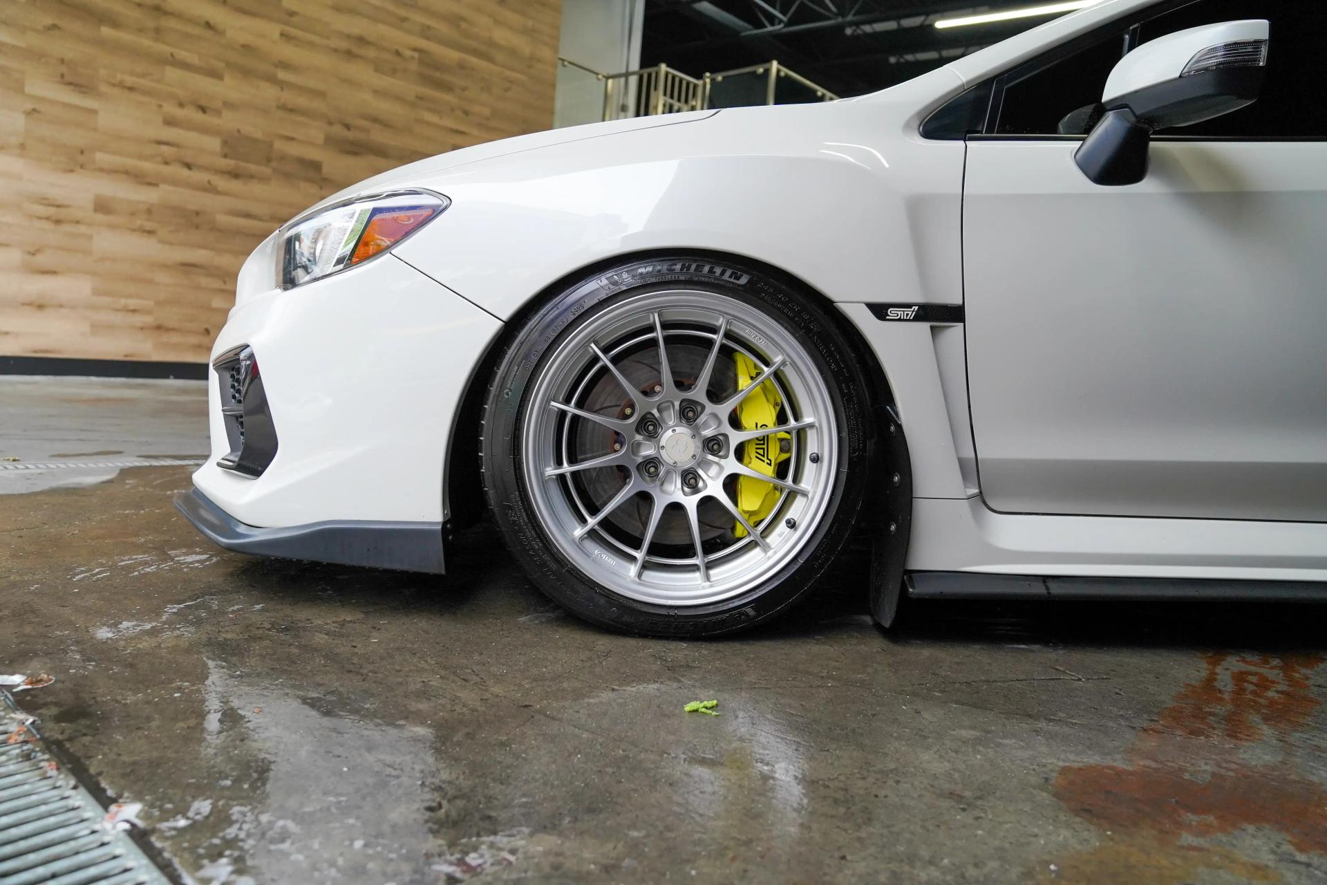 Paintless dent removal and wheel detailing on Subaru - Precision repair without paint damage